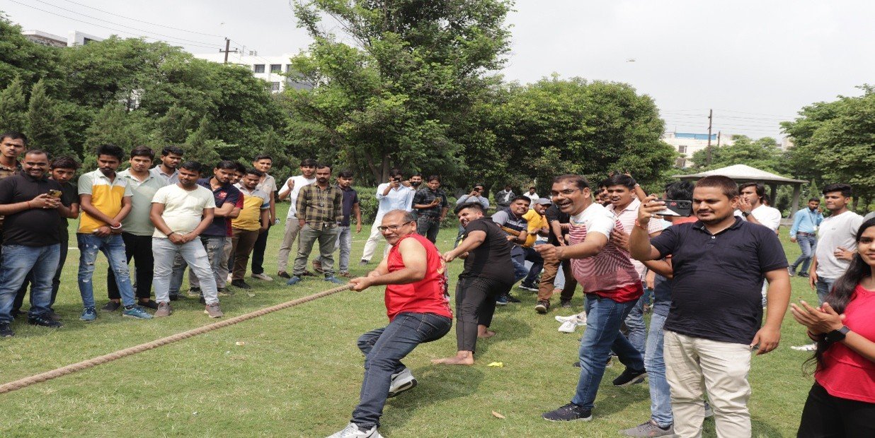 Participants taking part in an outdoor team-building activity