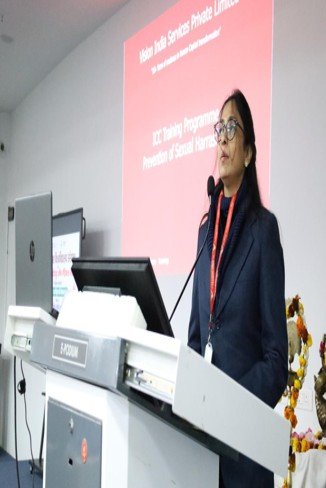 Trainer speaking at a podium during a XETA training event