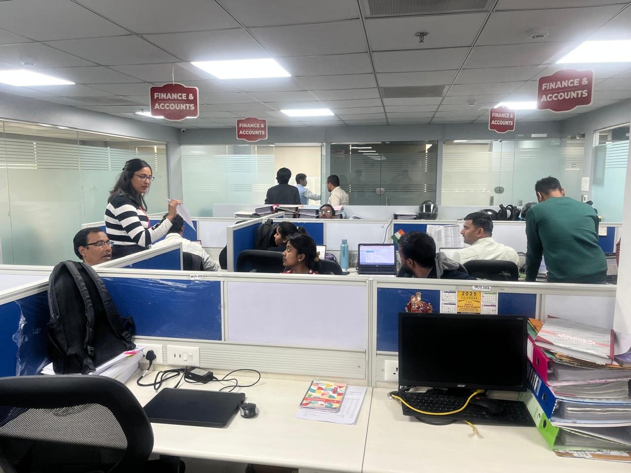 Priyanka guiding a team in a professional workspace