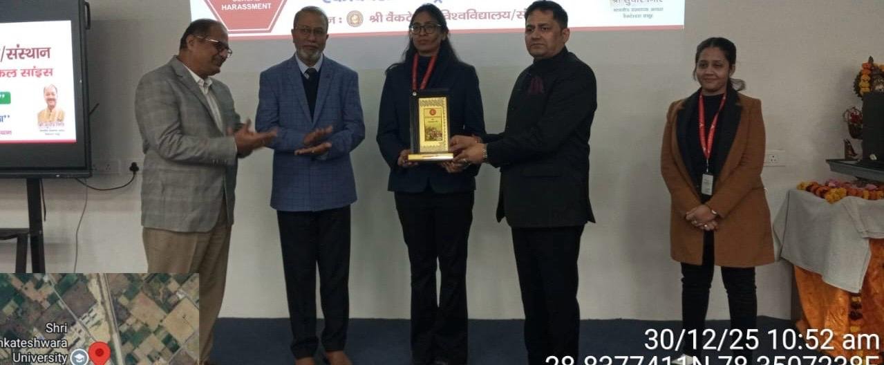 Priyanka receiving an award during a training event